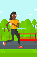 Image showing Sportive woman jogging.