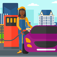 Image showing Woman filling up fuel into car.