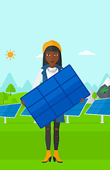 Image showing Woman holding solar panel.