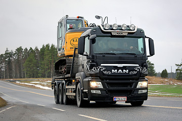 Image showing MAN TGS 35.540 Truck Hauls Excavator