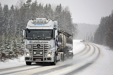 Image showing Mercedes-Benz Actros Tank Truck Pushes Forward in Winter Weather