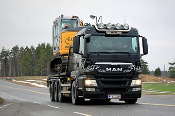 Image showing MAN TGS 35.540 Truck Hauls Excavator