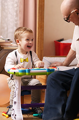 Image showing Candid portrait of a beautiful laughing toddler