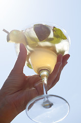 Image showing Female hand holding a cocktail