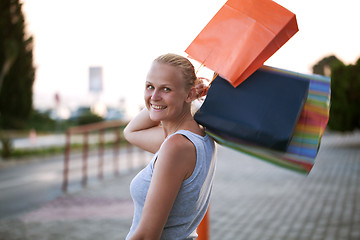 Image showing Young woman outdoor excited at good shopping