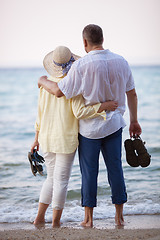 Image showing Couple embracing and looking at sea