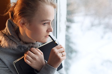 Image showing Young girl in a deep thoughts