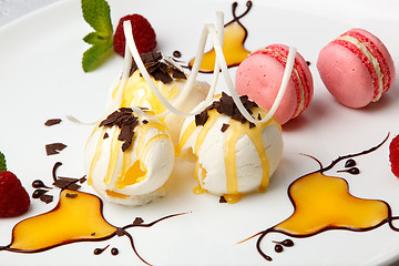 Image showing Pink macaroons with vanilla ice cream and honey