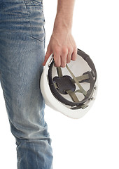 Image showing Male engineer in jeans holding white hardhat