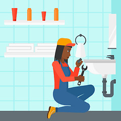 Image showing Woman repairing sink.