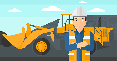 Image showing Miner with mining equipment on background.