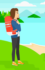 Image showing Woman with backpack hiking.