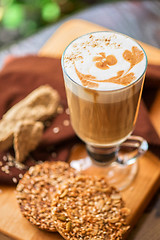 Image showing coffee latte cup with cookies