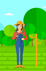 Image showing Farmer with pruner in garden.