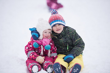 Image showing children group  having fun and play together in fresh snow