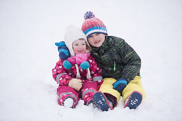 Image showing children group  having fun and play together in fresh snow