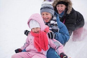 Image showing children group  having fun and play together in fresh snow