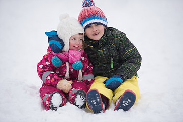 Image showing children group  having fun and play together in fresh snow