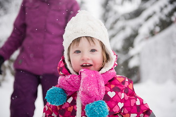 Image showing little girl have fun at snowy winter day