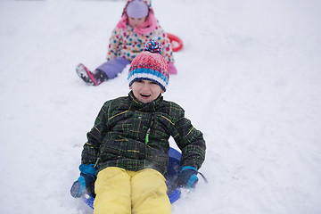 Image showing children group  having fun and play together in fresh snow