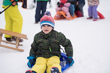 Image showing children group  having fun and play together in fresh snow