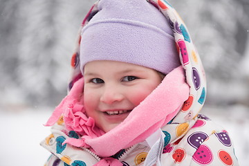 Image showing little girl have fun at snowy winter day