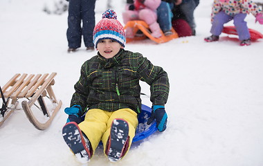 Image showing children group  having fun and play together in fresh snow