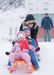 Image showing children group  having fun and play together in fresh snow