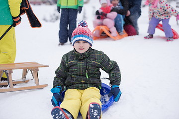 Image showing children group  having fun and play together in fresh snow