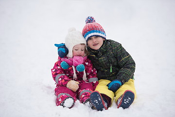 Image showing children group  having fun and play together in fresh snow