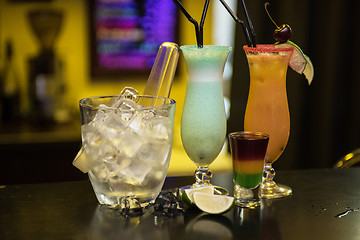 Image showing cocktails on bar background