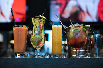 Image showing cocktails on bar background