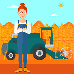 Image showing Woman standing with combine on background.