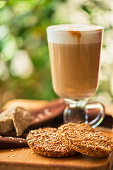 Image showing coffee latte cup with cookies