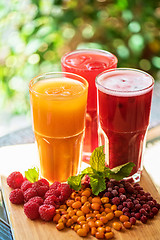 Image showing fruit drink with cranberries raspberries and sea buckthorn