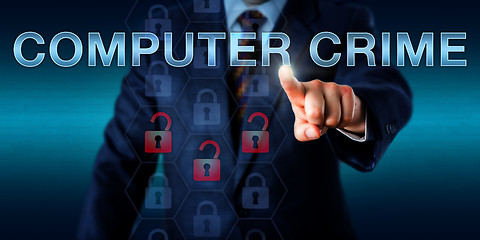 Image showing Forensic Investigator Pushing COMPUTER CRIME\r