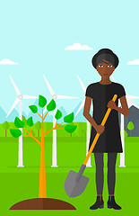 Image showing Woman plants tree.