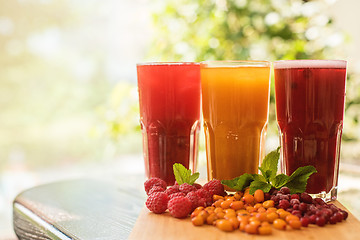 Image showing fruit drink with cranberries raspberries and sea buckthorn