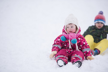 Image showing children group  having fun and play together in fresh snow