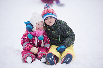 Image showing children group  having fun and play together in fresh snow