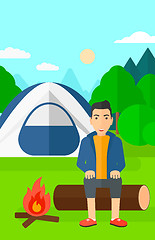 Image showing Man sitting at camp.