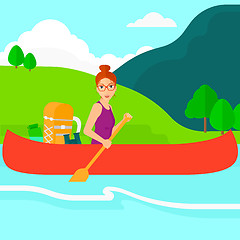Image showing Woman canoeing on the river.