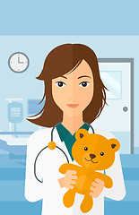 Image showing Pediatrician holding teddy bear.