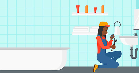 Image showing Woman repairing sink.