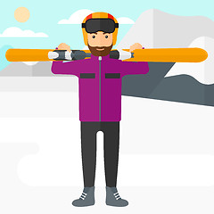 Image showing Man holding skis.