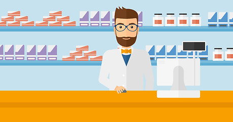 Image showing Pharmacist at counter with computer monitor.