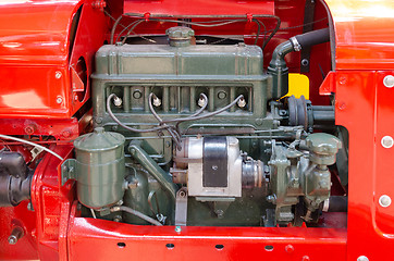 Image showing a green diesel engine i a red tractor