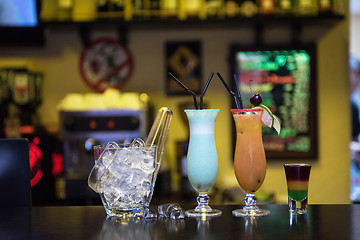 Image showing cocktails on bar background