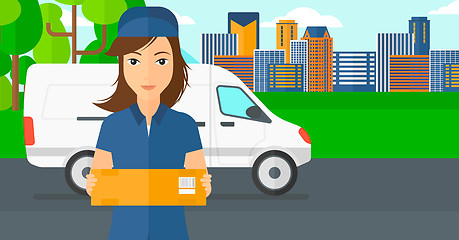 Image showing Woman delivering box.