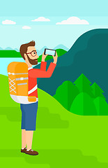 Image showing Backpacker taking photo.